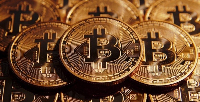 Най-популярната в света криптовалута биткойна (bitcoin) и криптовалутата Ripple в